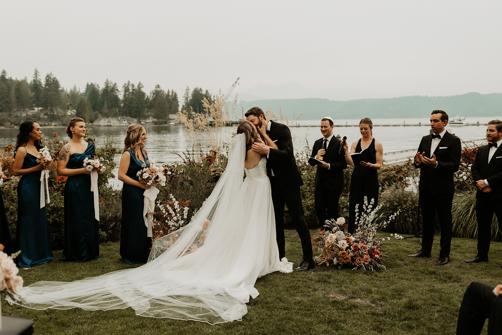 bride and groom kiss at the end of ceremony at alderbrook resort