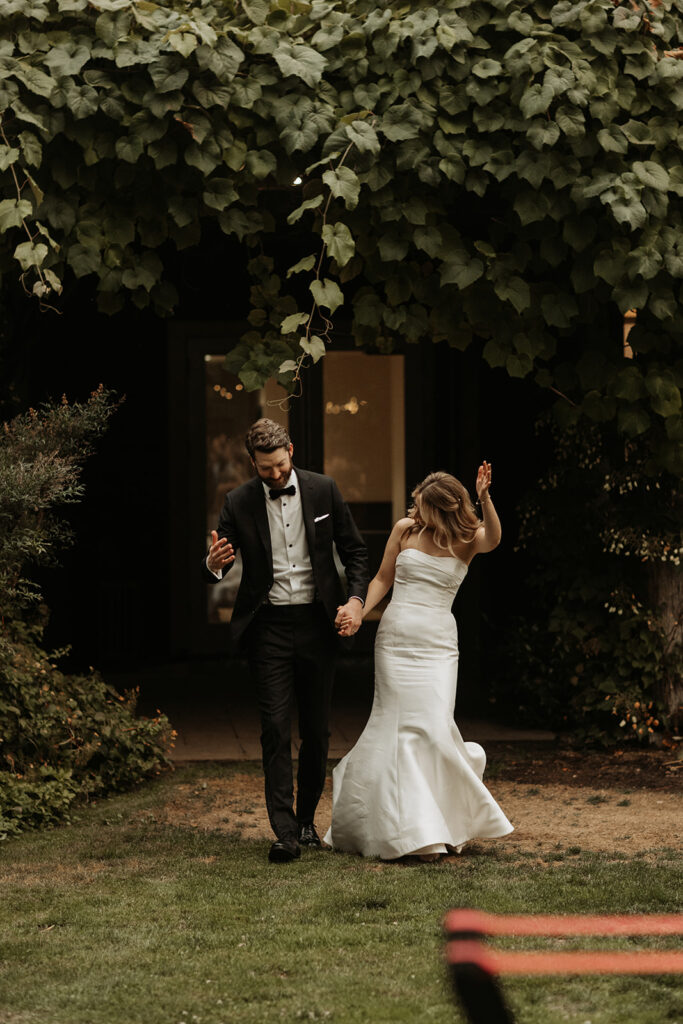 bride and groom make entrance during alderbrook wedding