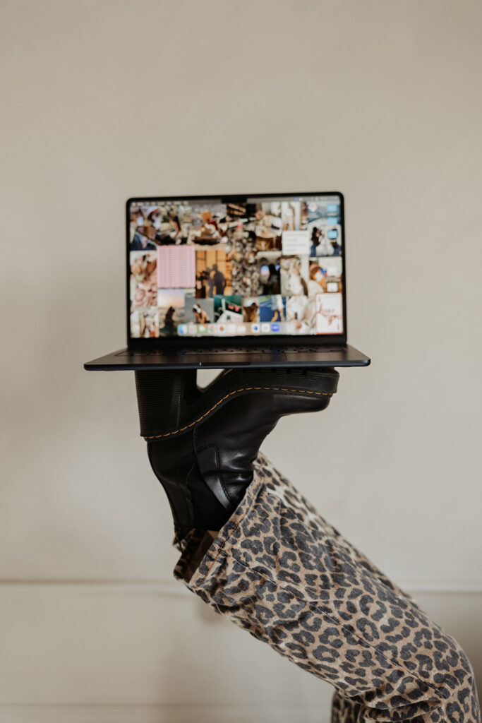 feet holding up laptop